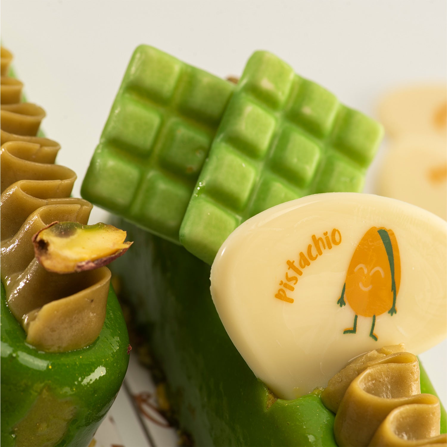  TABLETTA CHOCO BLANCO PISTACHO 35X26MM - 36 UDS